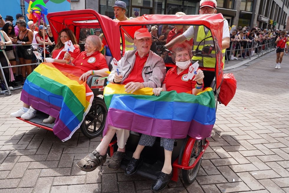 A photo of a elder people participating in a pride event.