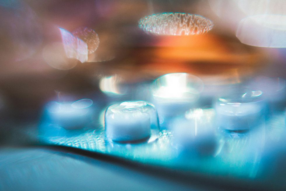 A photo of a pill container