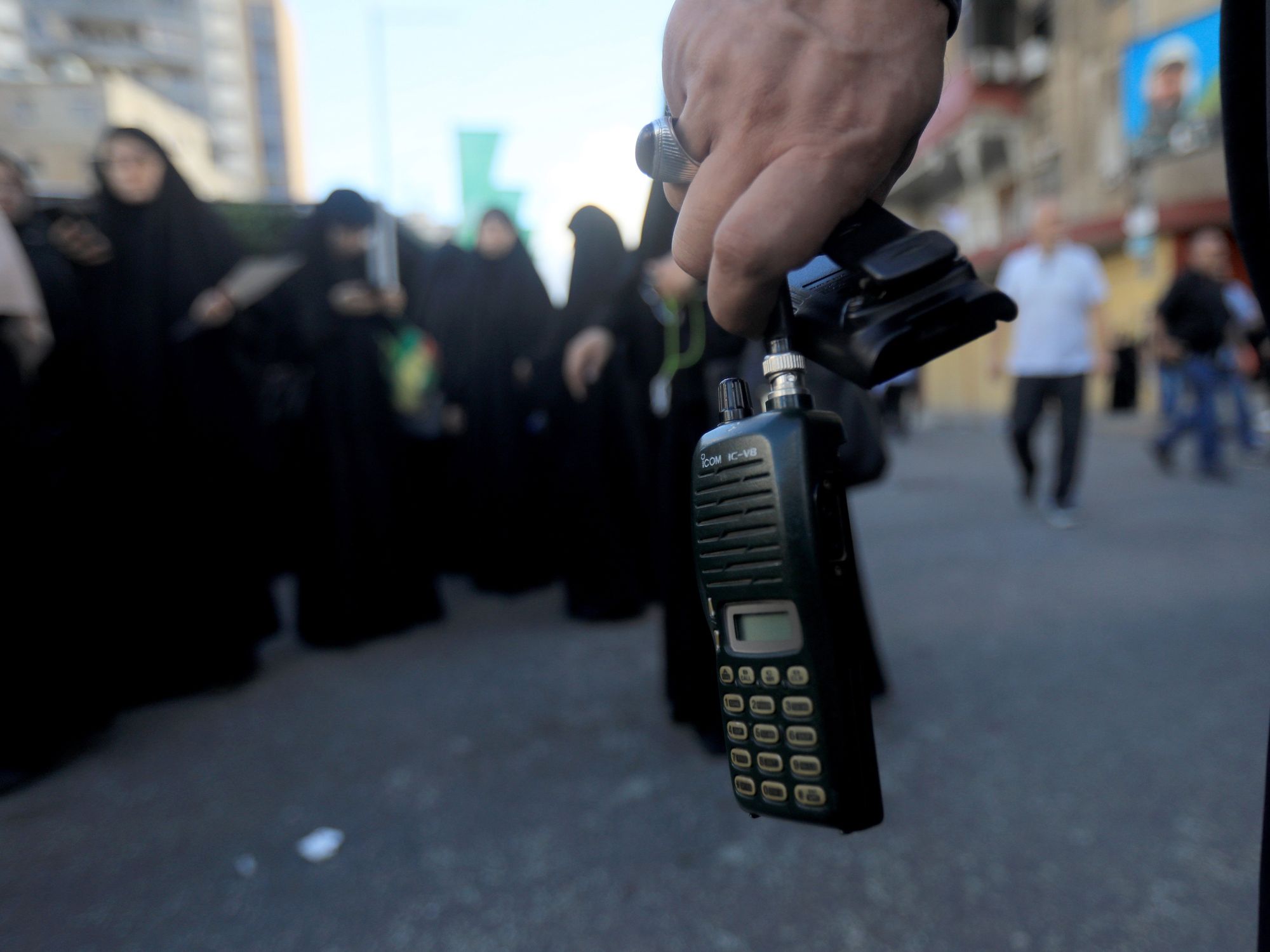 A photo of a wireless communication device in the hand of a hezbollah member.