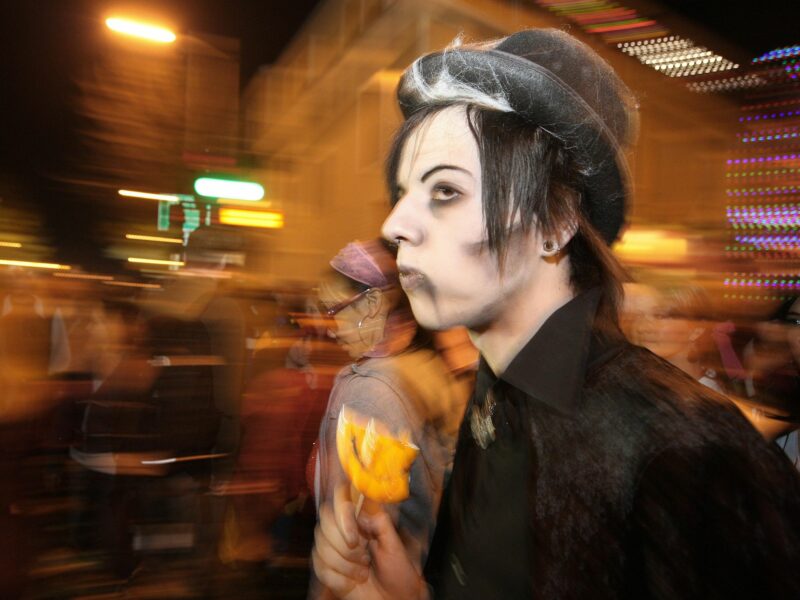 A photo of a young man dressed up as witch