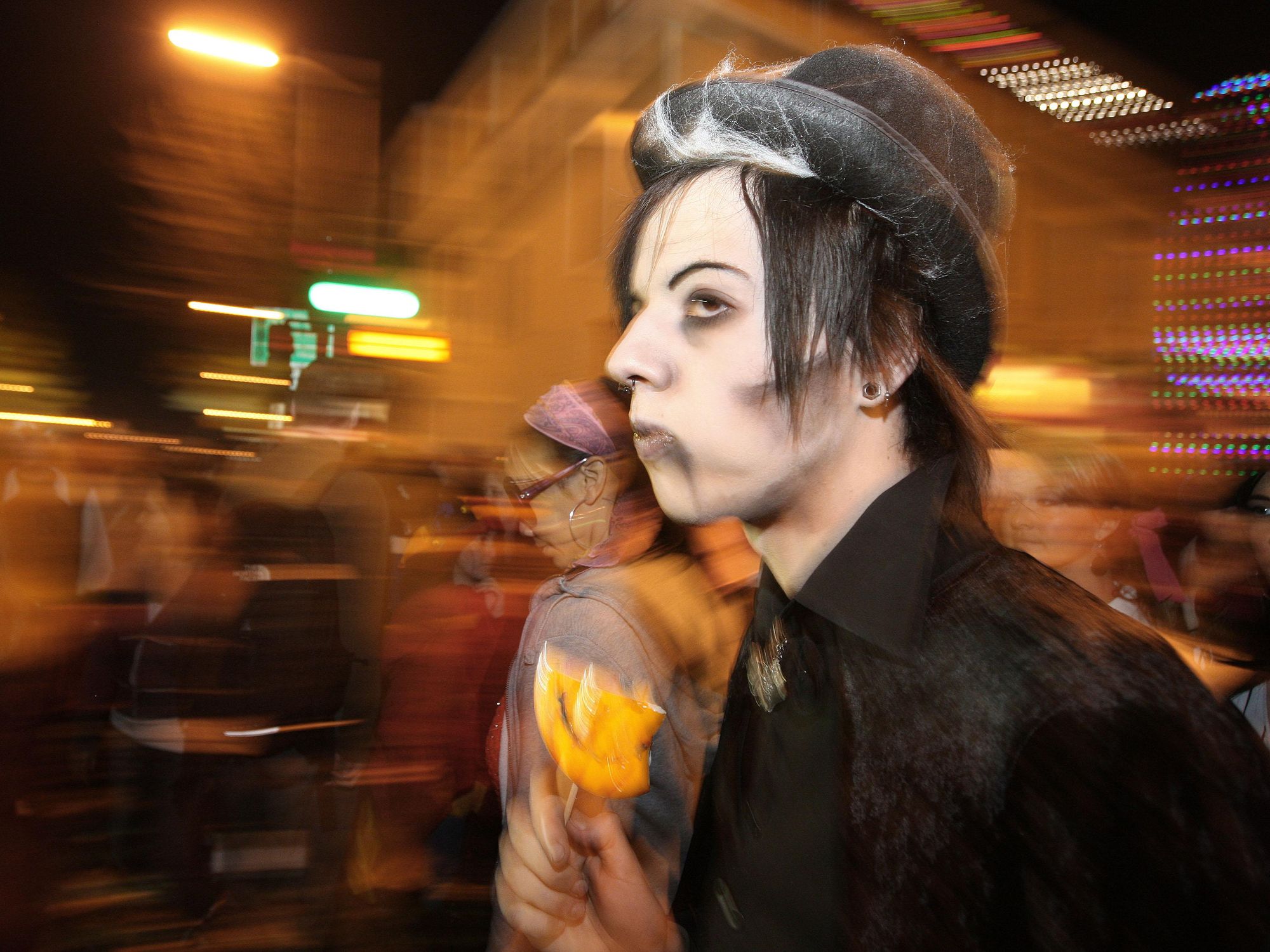 A photo of a young man dressed up as witch
