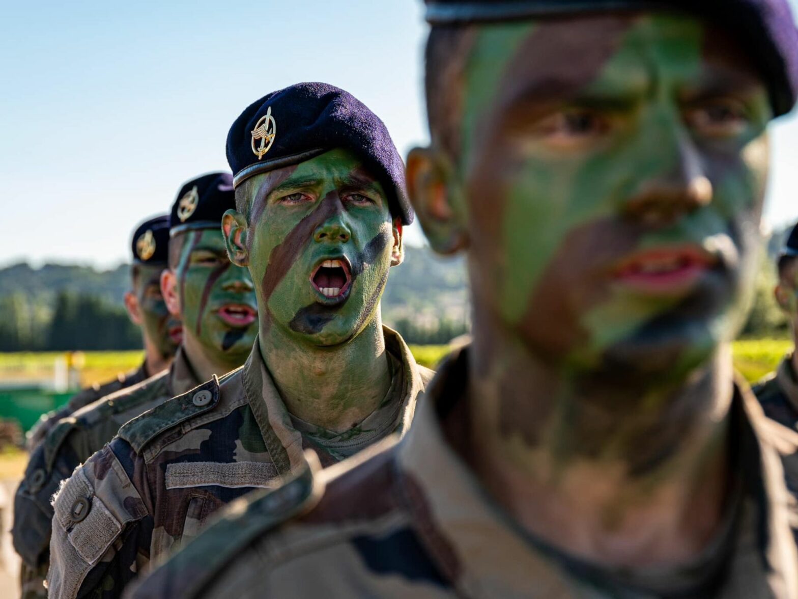 A photo of French soldiers with face paint.