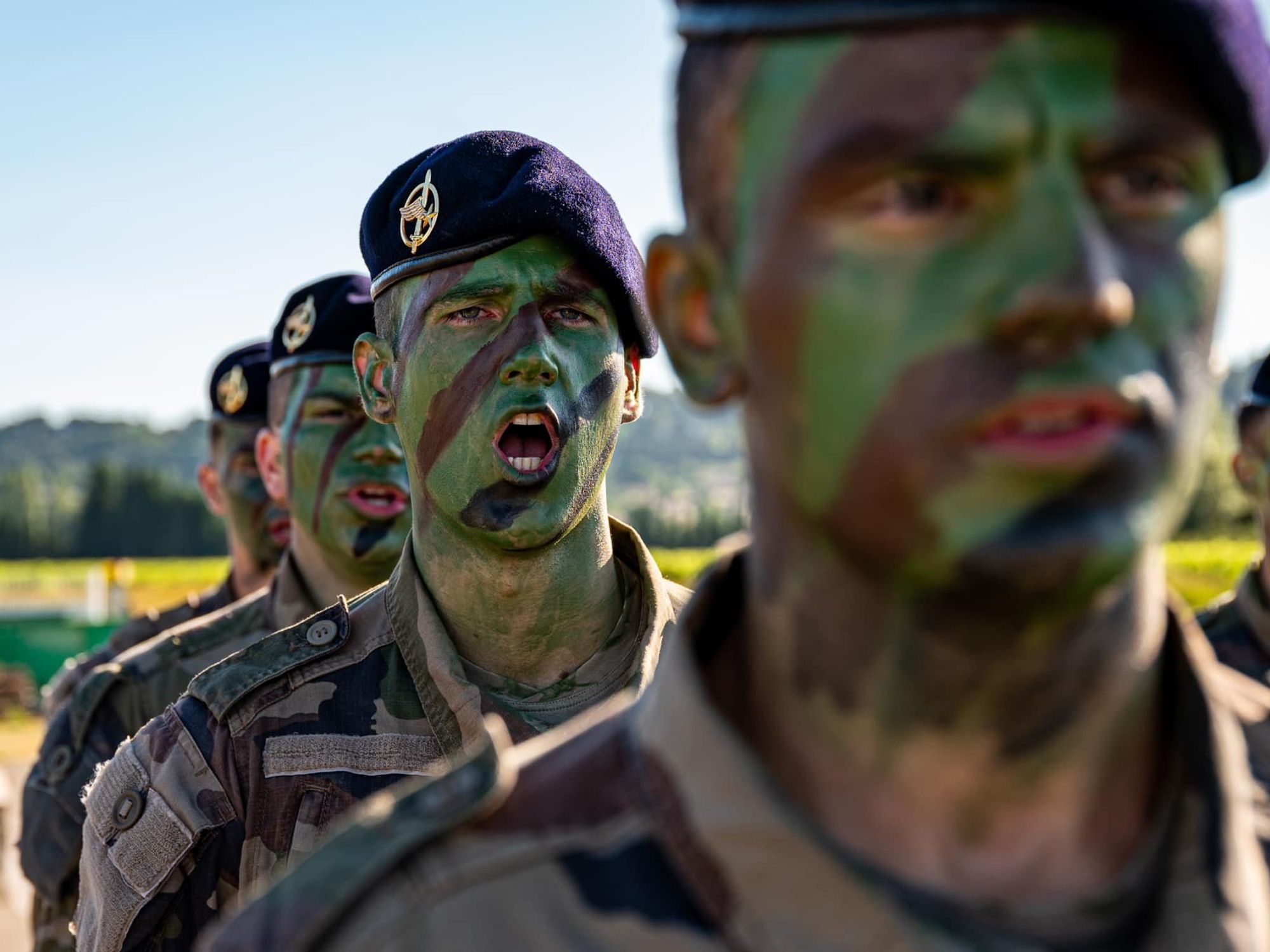 A photo of French soldiers with face paint.