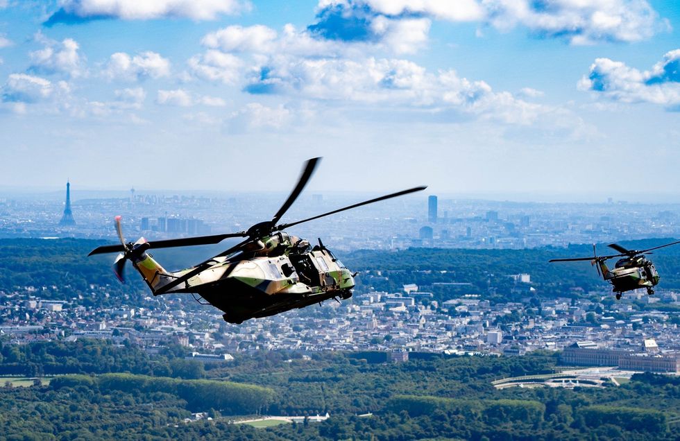 a photo of helicopters flying over Paris