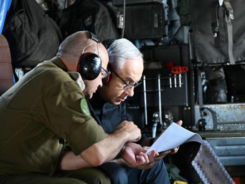 A photo of Israeli Prime Minister Benjamin Netanyahu (right) visiting the Ramat David Air Force Base in northern Israel