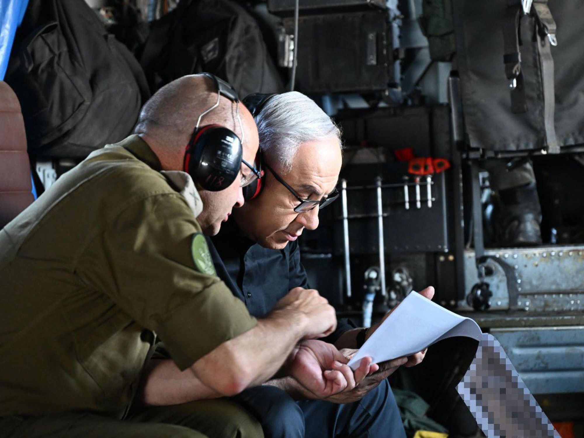 A photo of Israeli Prime Minister Benjamin Netanyahu (right) visiting the Ramat David Air Force Base in northern Israel
