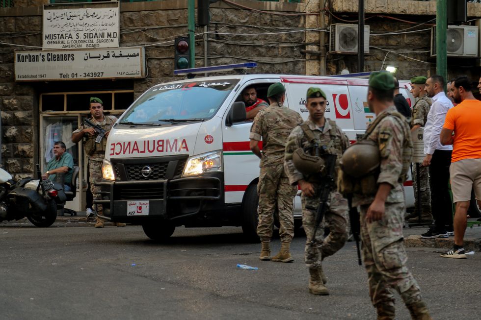A photo of Lebanese soldiers securing the area around the American University Hospital after an attack killed 8 people in Beirut Lebanon.