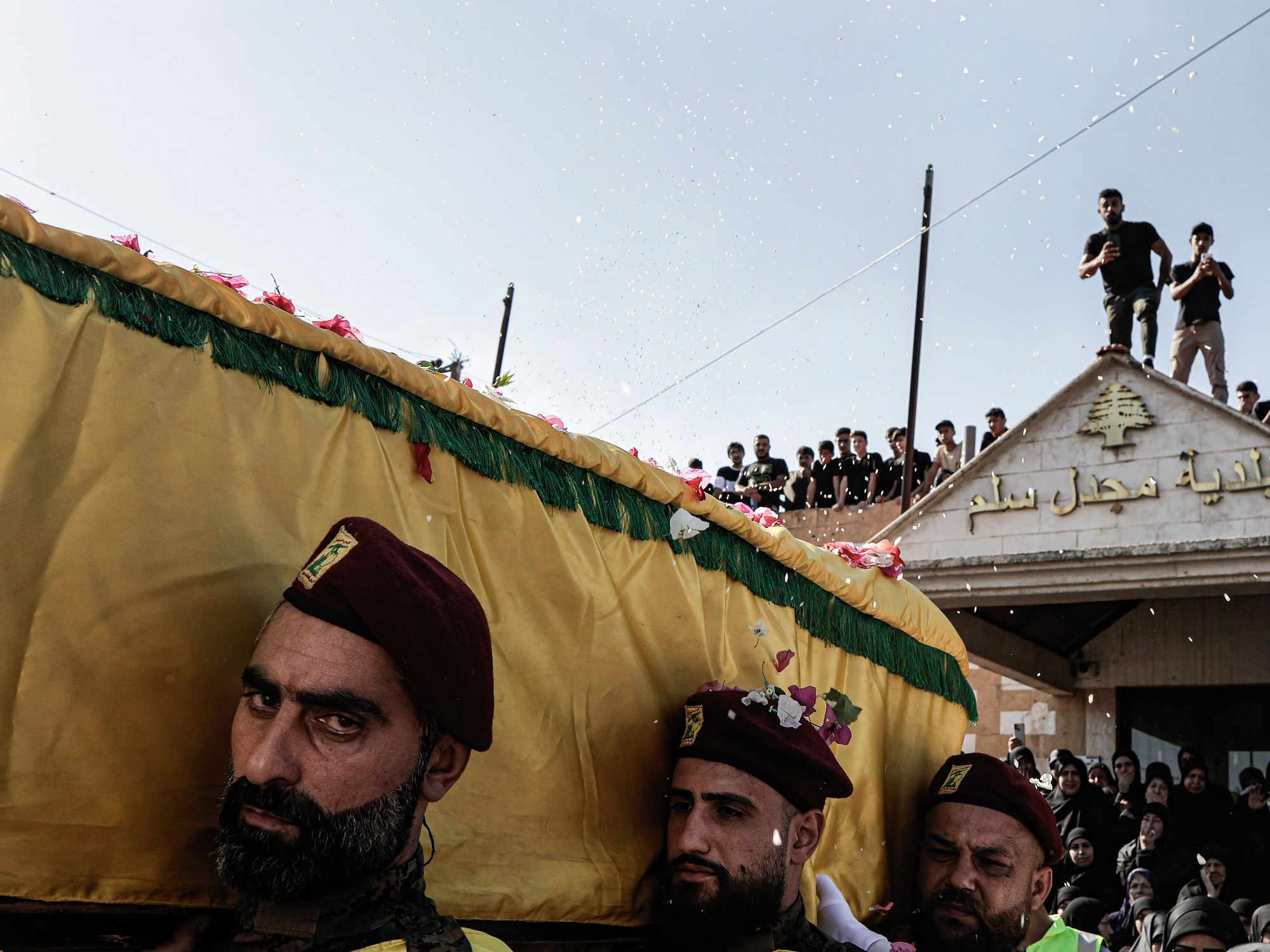A photo of mourners carrying the coffin of Hezbollah fighter Abbas Badii Milhim.