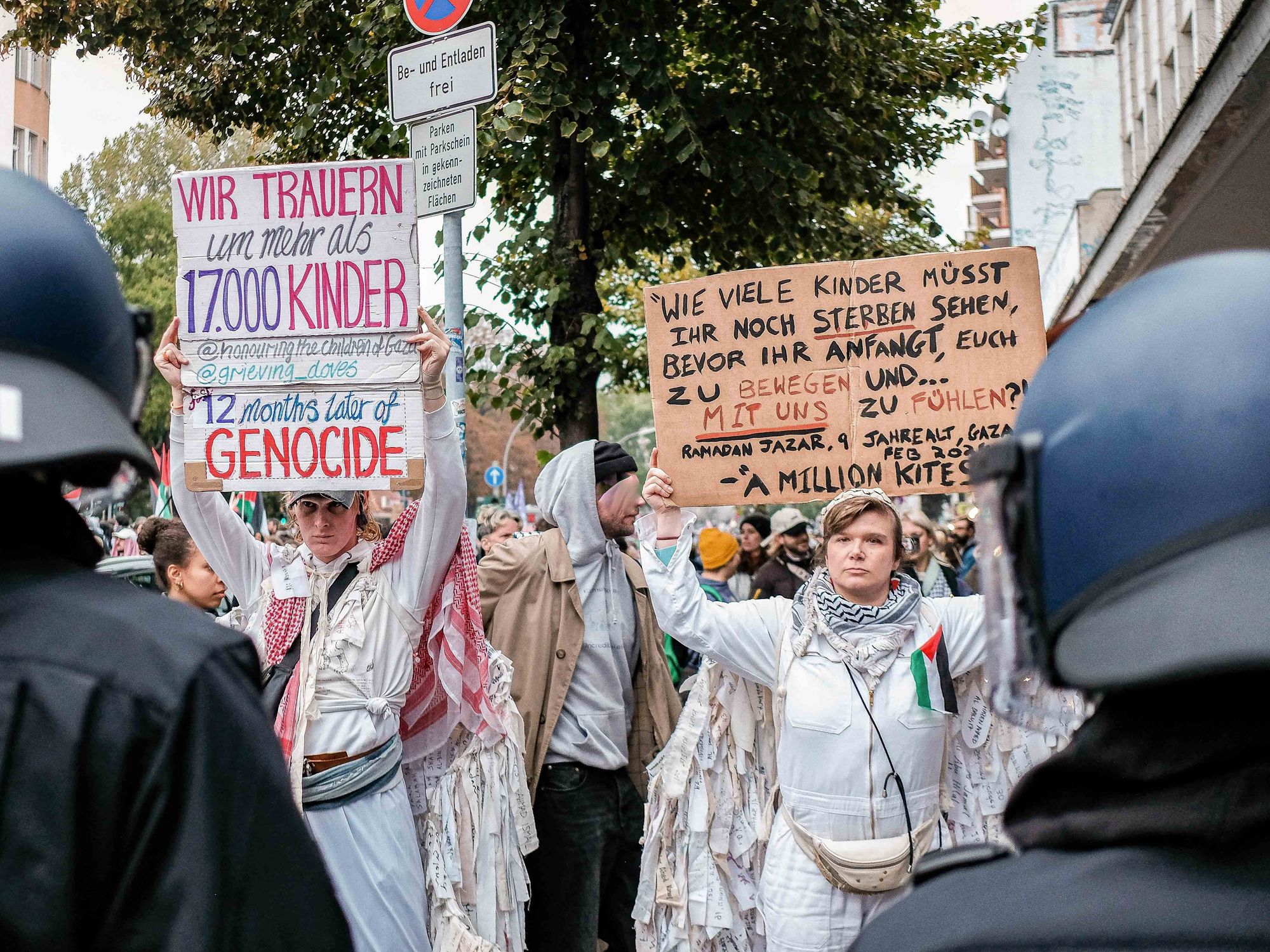 A photo of protesters marching to show solidarity with palestinians in Gaza.