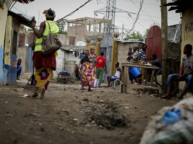 A photo of two women on a dirt road in Kinshasa.