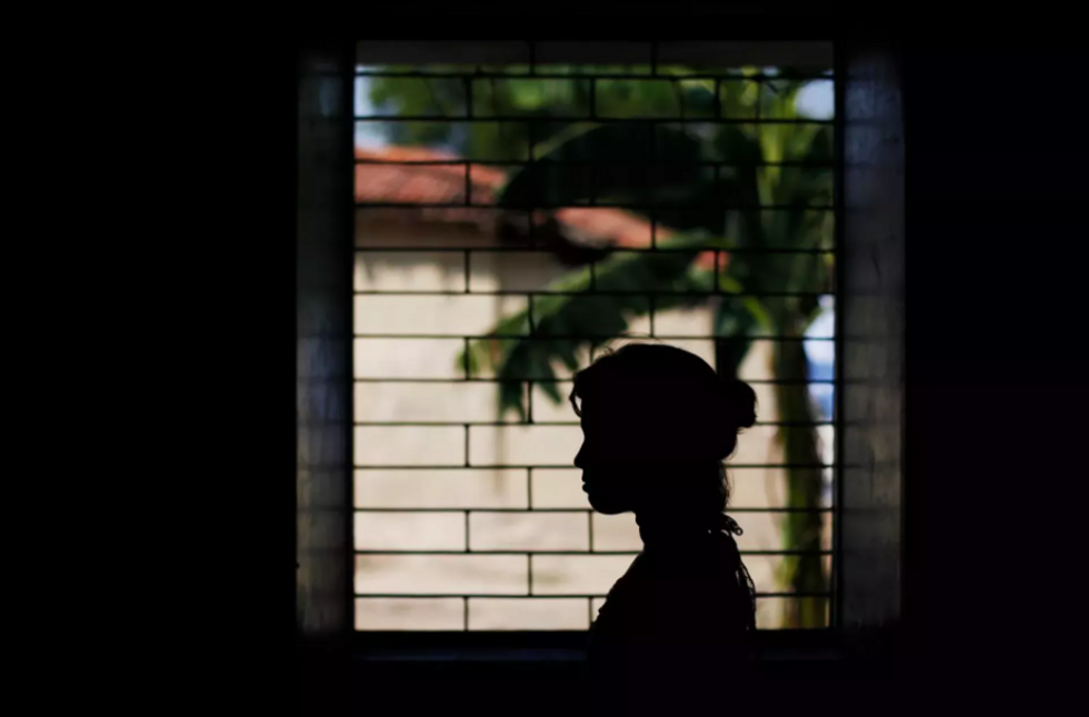 A photograph of a young woman in Latin America.