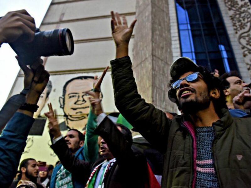 A photojournalist at work in Cairo in December