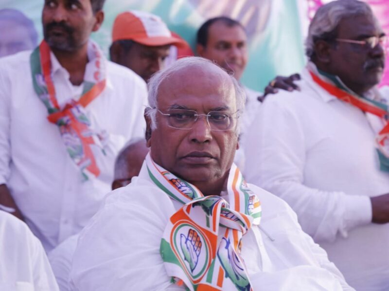 A picture of ​Mallikarjun Kharge amidst a crowd.