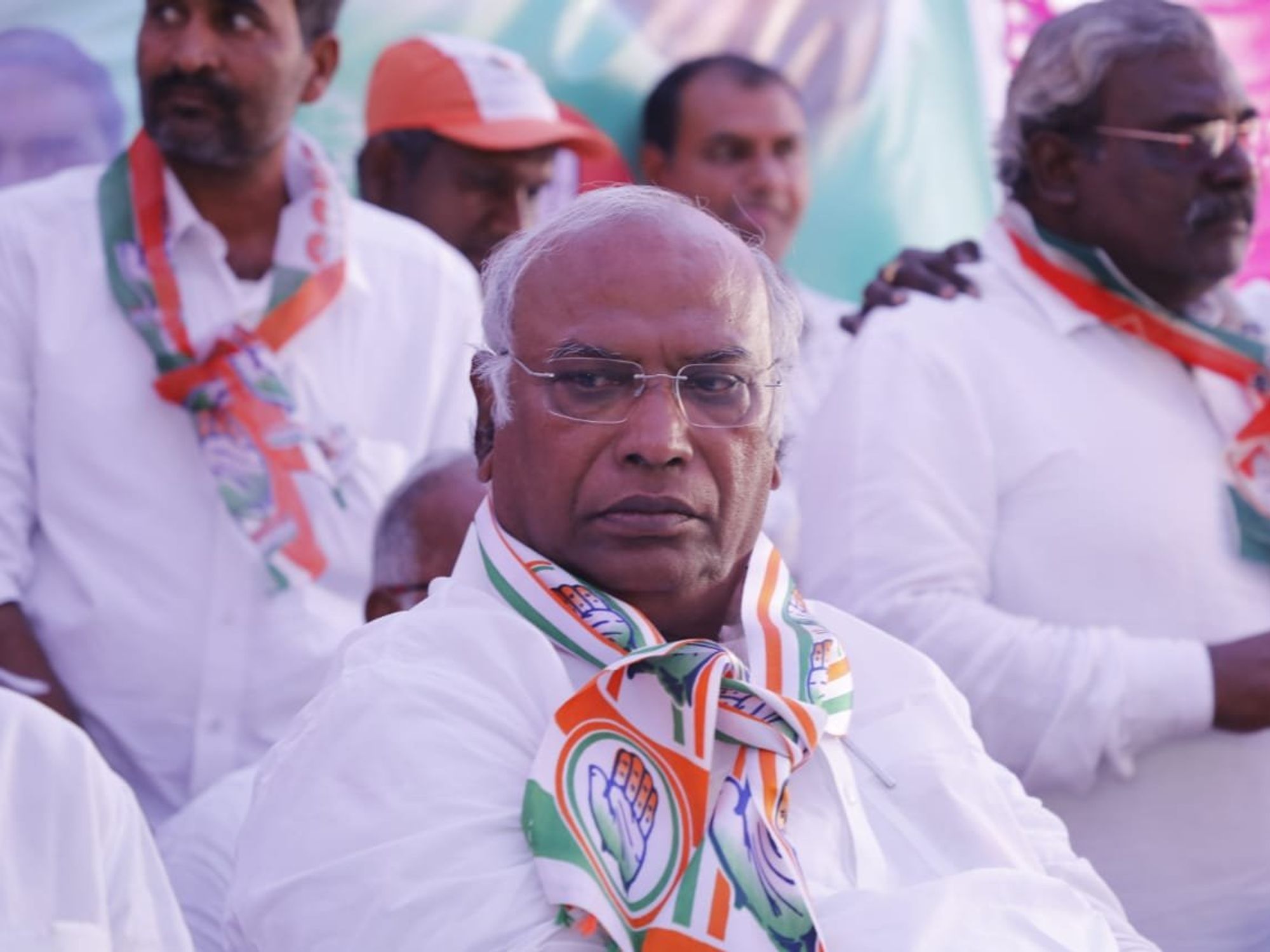 A picture of ​Mallikarjun Kharge amidst a crowd.