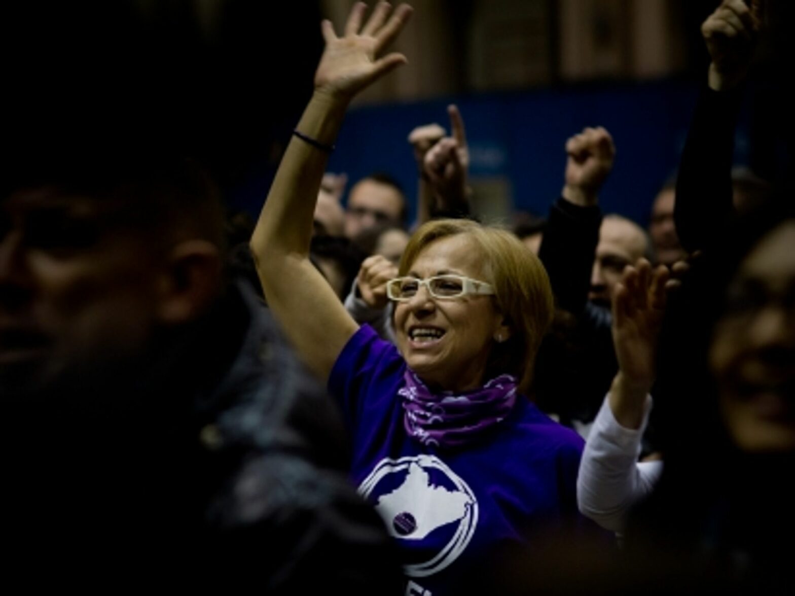 A Podemos supporter watching poll results in Barcelona