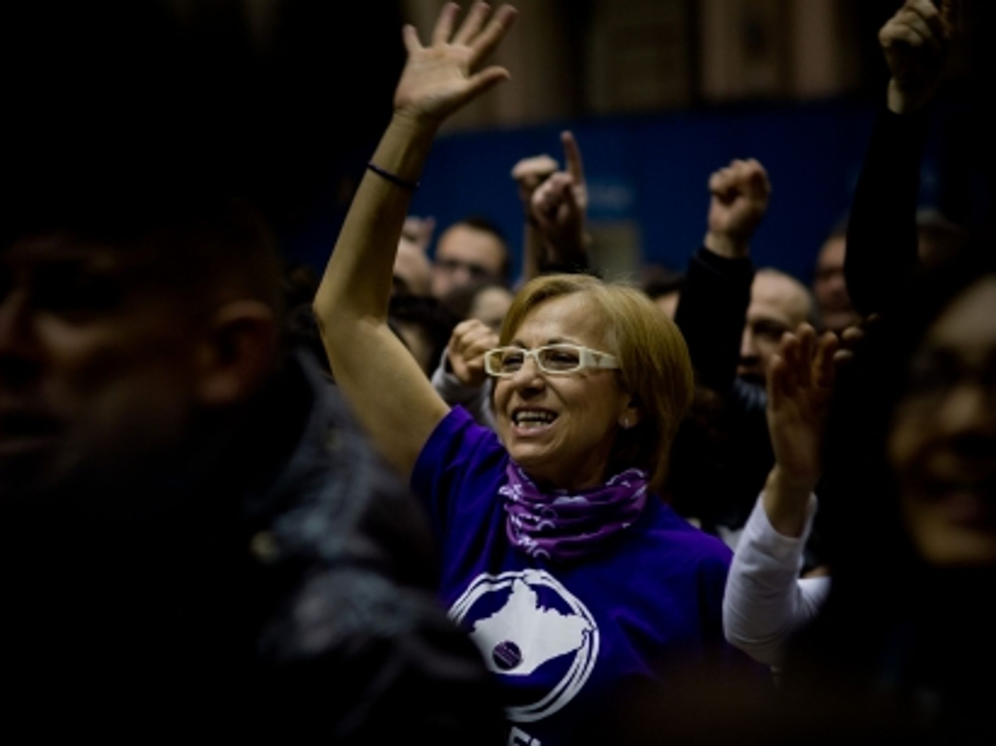 A Podemos supporter watching poll results in Barcelona