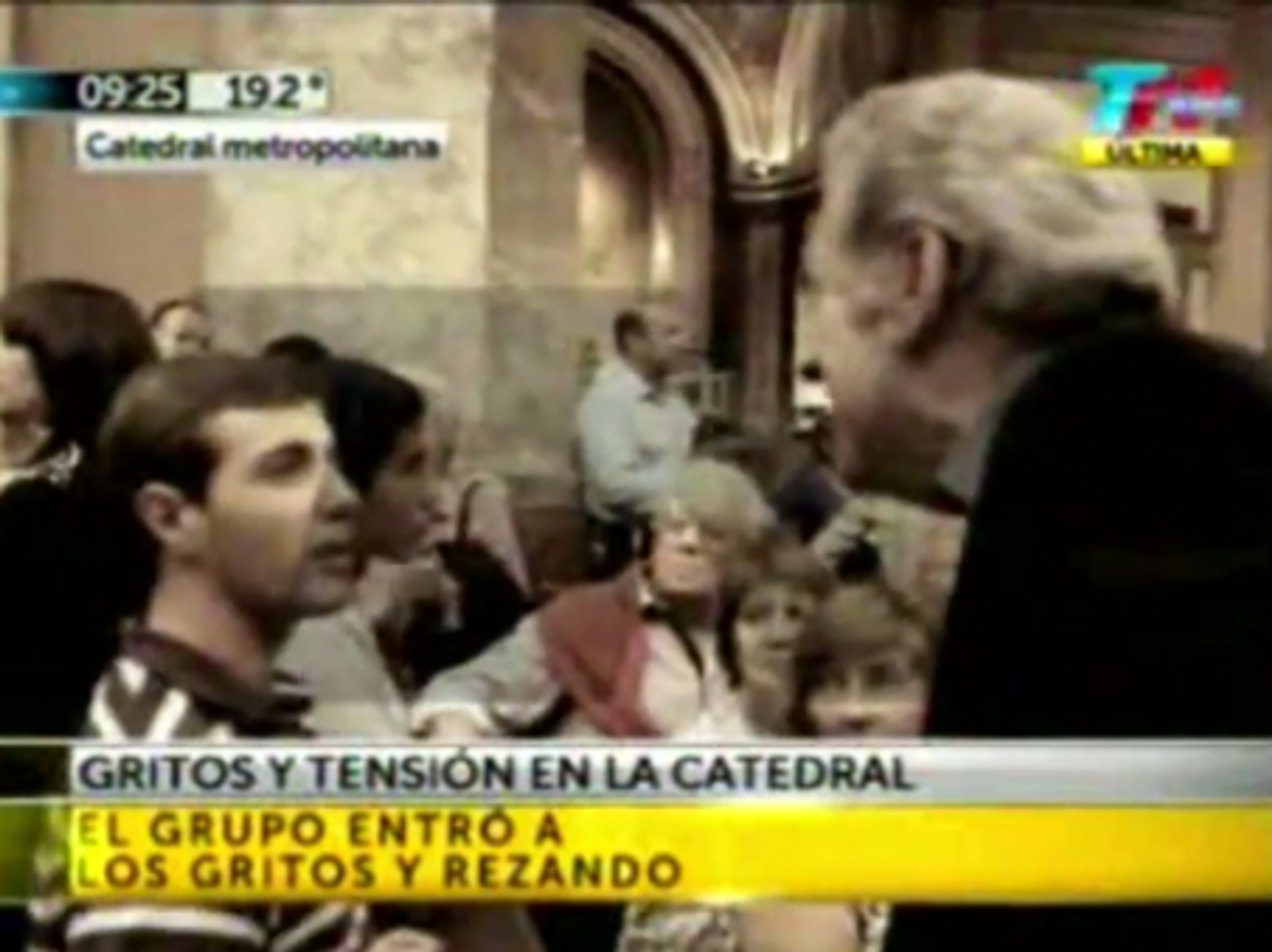 A priest confronts a protester