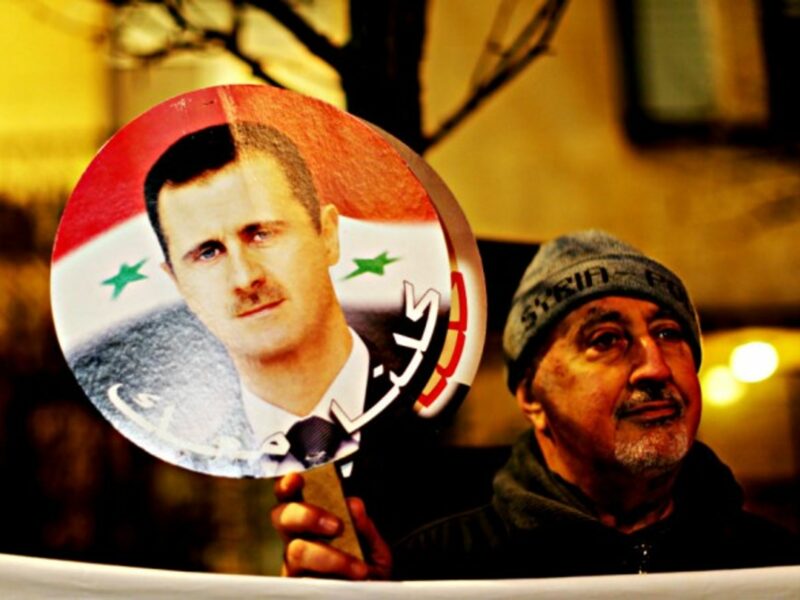 A pro-Assad protester in Warsaw last month