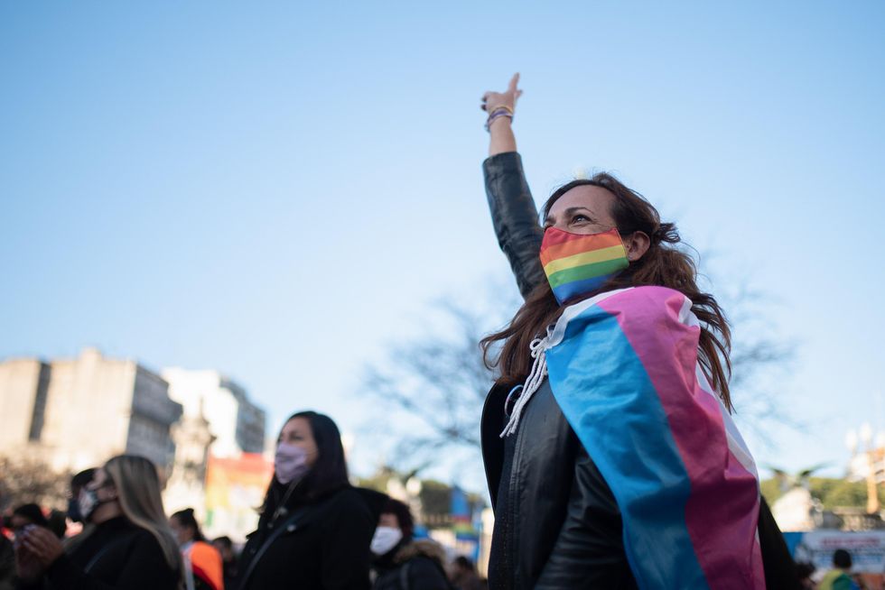A protester attends a vigil in support of the passing of a law creating a work quota for transvestites and transgender people in Buenos Aires on June 24, 2021.