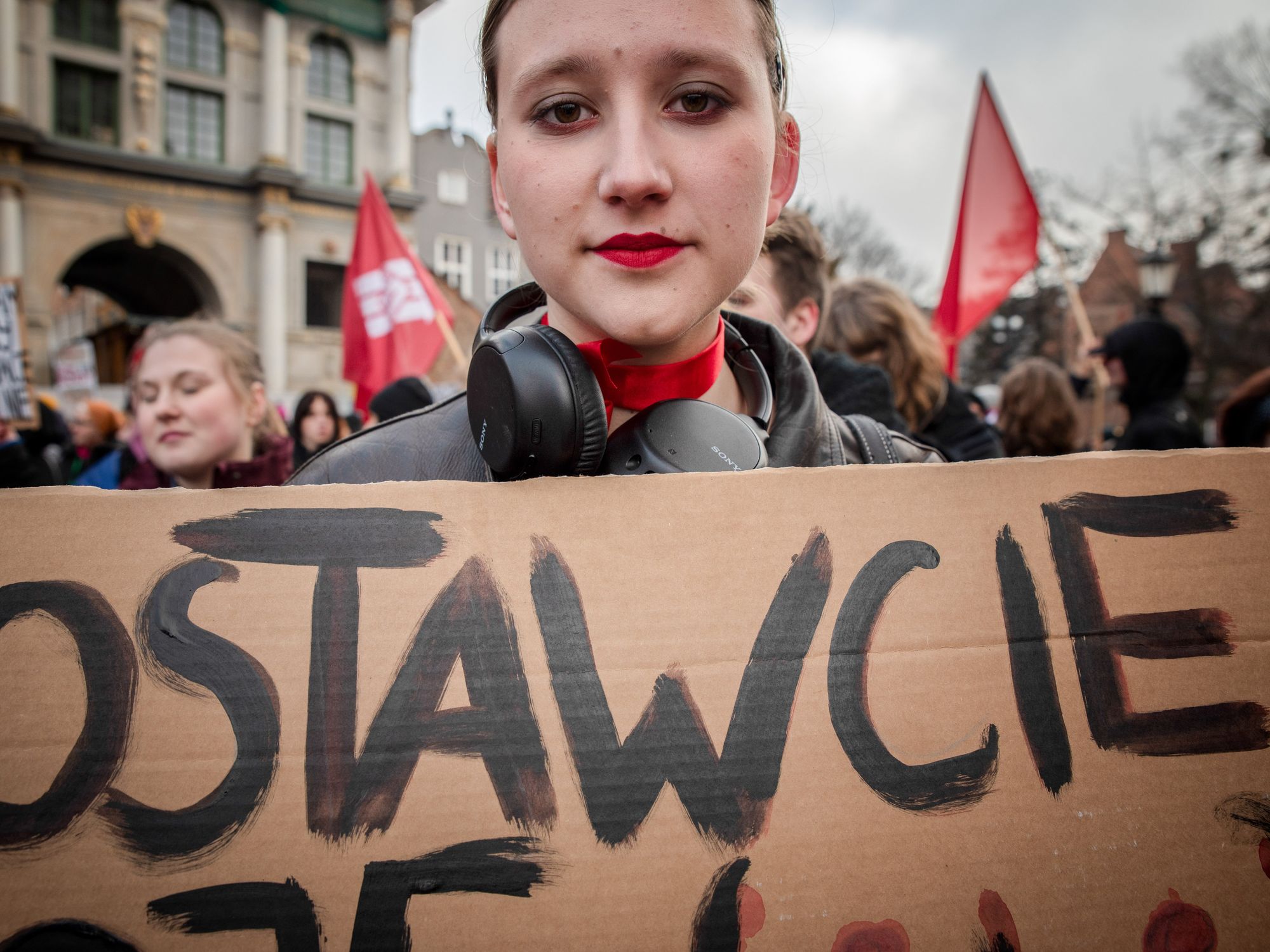 A protester holds a placard expressing her opinion during the women's demonstration.