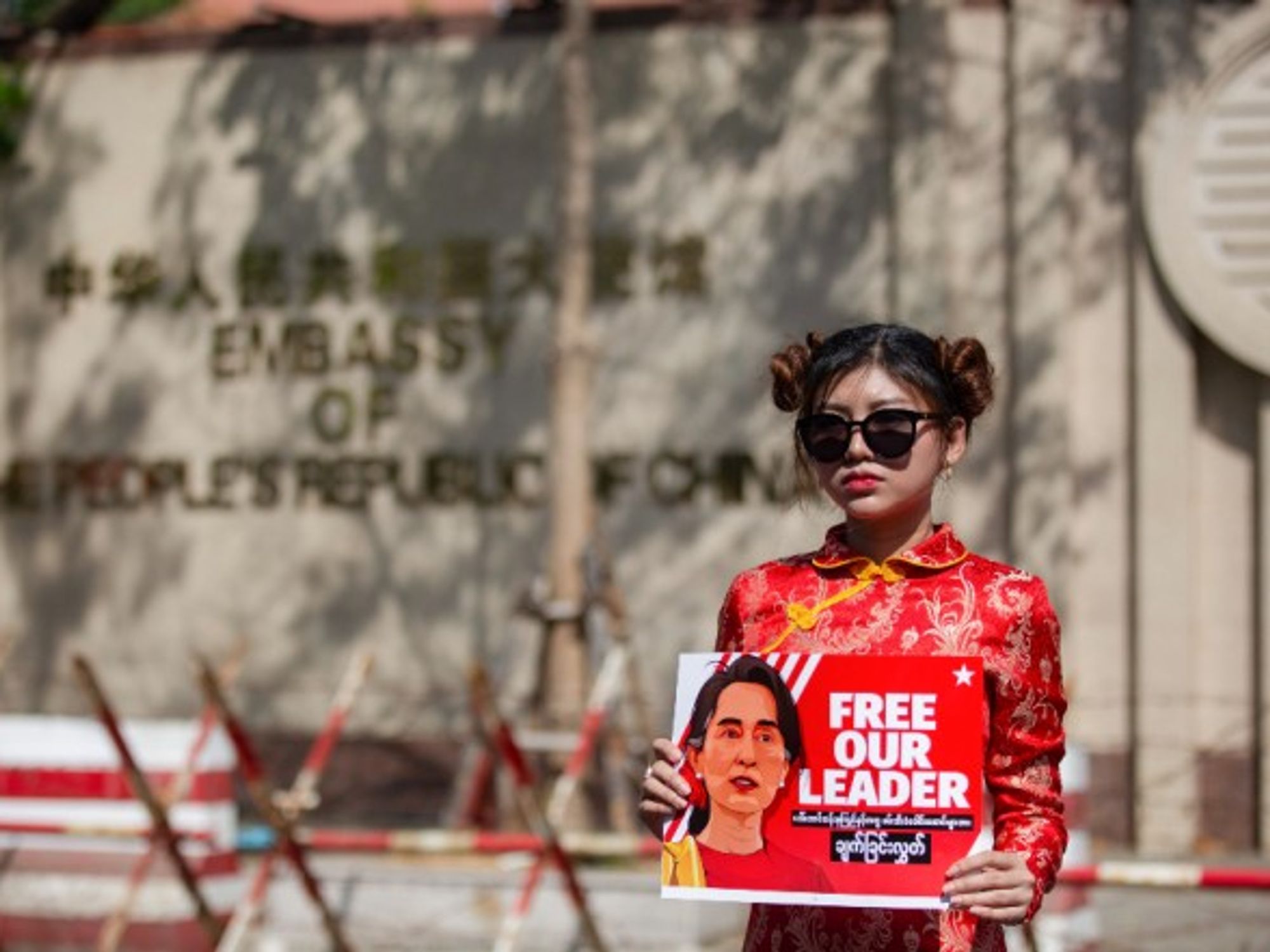 A protester in front of China's embassy in Yangon