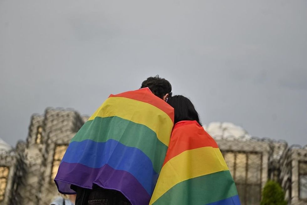 A queer couple sharing a moment.