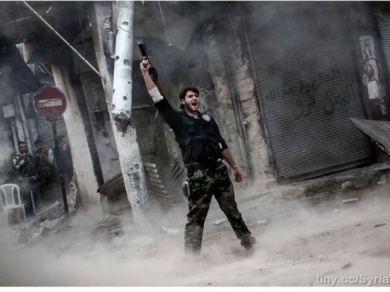 A rebel fighter after unloading his shoulder-fired missile toward Assad loyalists