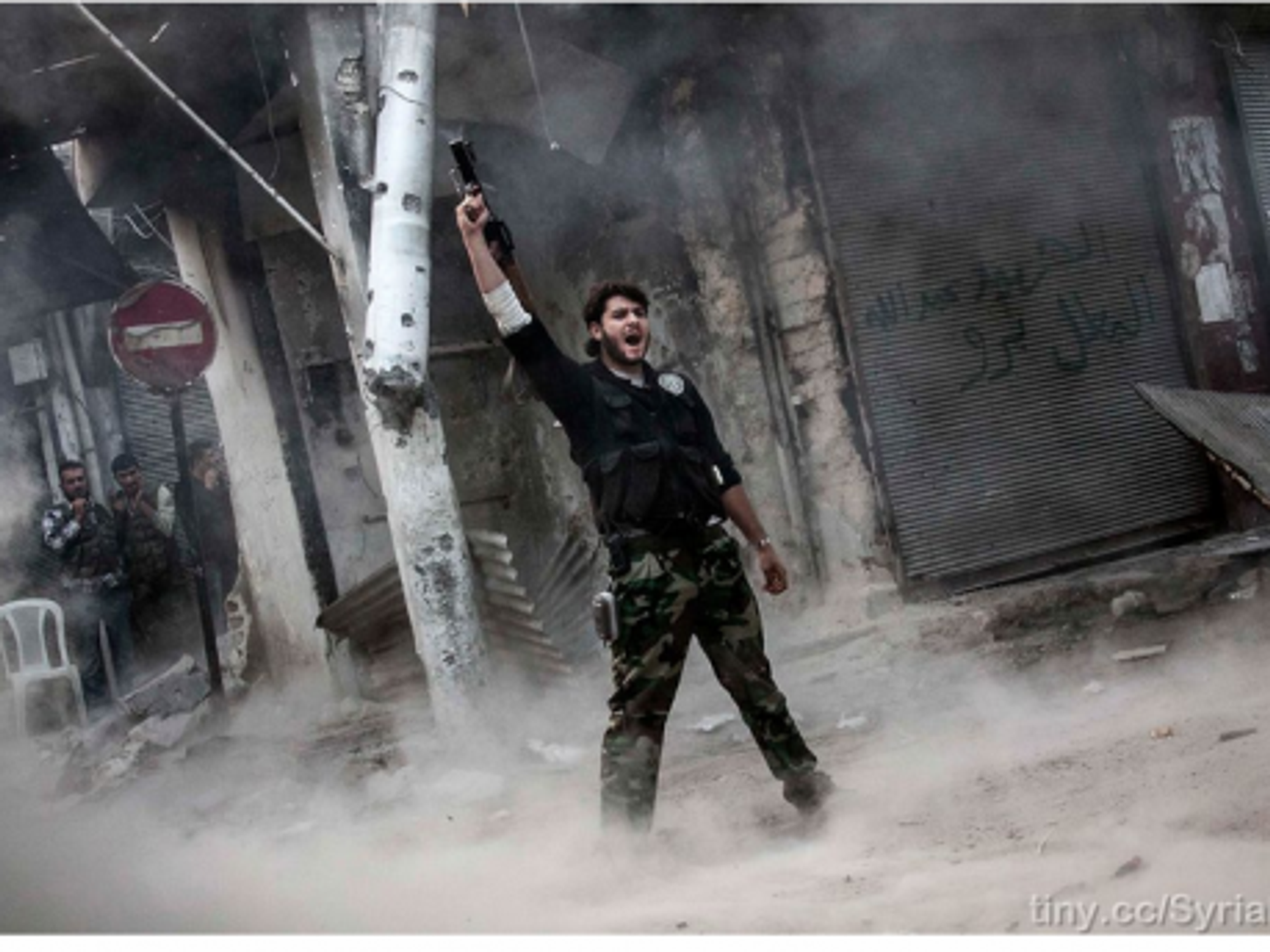 A rebel fighter after unloading his shoulder-fired missile toward Assad loyalists