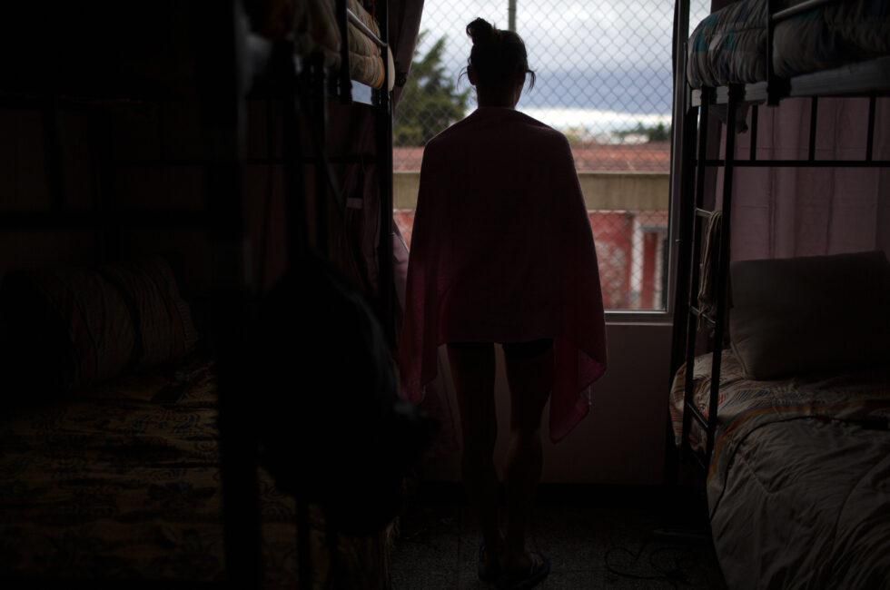 A refugee looks outside the window