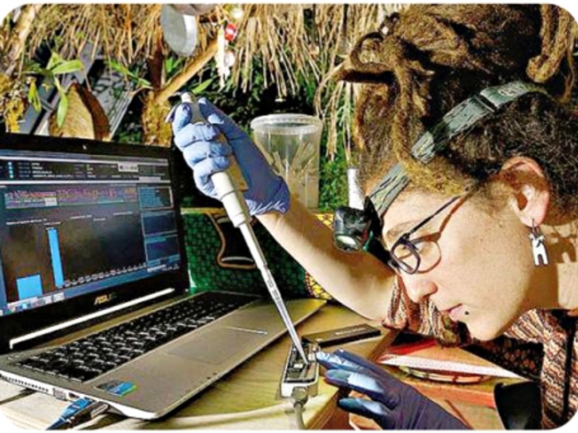 A researcher using the DNA Field Lab