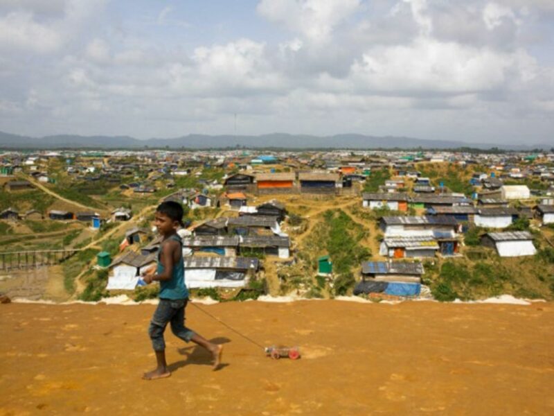A Rohingya refugee looking over Cox's Bazar refugee camp in Bangladesh