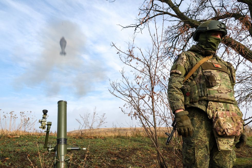 A Russian soldier uses a mortar on the frontlines near Zaporizhzhia on Nov. 22