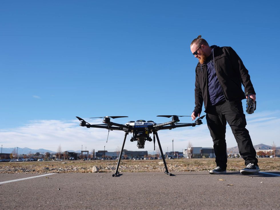 A safety pilot stands by Fortem’s DroneHunte in Pleasant Grove, Utah, near the company's headquarters.