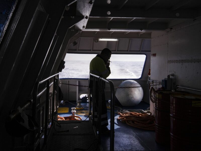 A sailor smokes a cigarette on the hydrofoil Procida