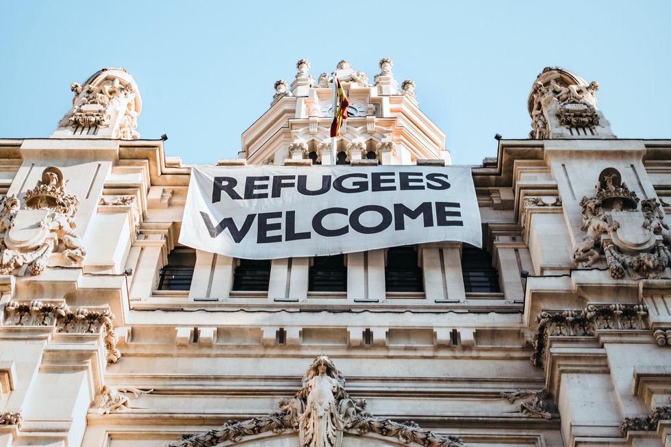 A sign in Madrid that says: Refugees Welcome