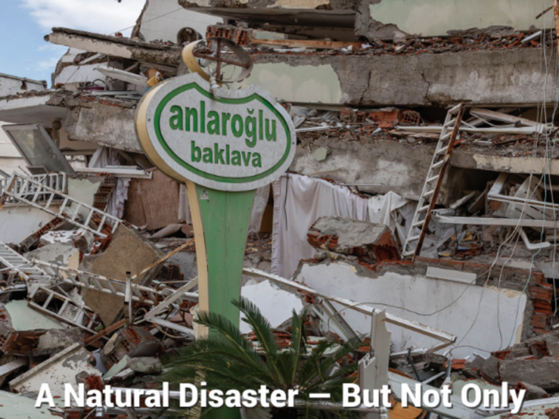A sign that still stands in the middle of the ruins following the earthquakes, with the writing baklava a Turkish dessert