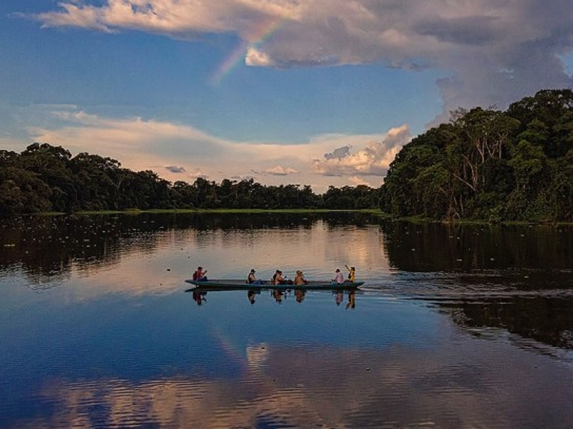 A small boat sailing on a river in Ecuador