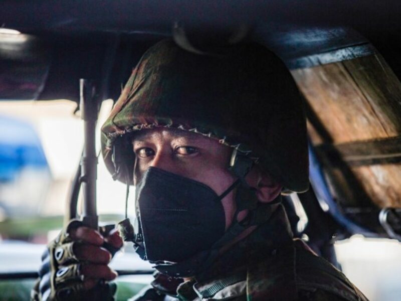A soldier sits inside a military truck outside an Hindu temple in Yangon, Myanmar, where power has been handed to commander-in-chief Min Aung Hlaing following a military coup