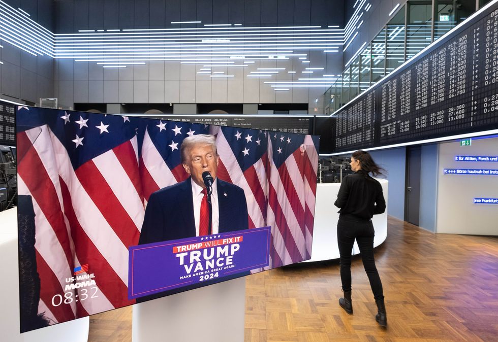 A speech by US presidential candidate Donald Trump is broadcast live on a monitor in the trading hall of Deutsche Büerse in Frankfurt.