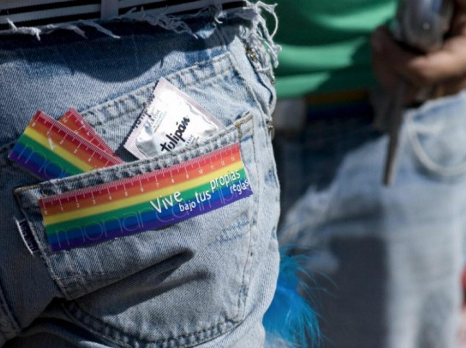A sticker on the back of a marcher's jeans reads 'live under your own rules' and he carries a condom in his back pocket during the 17th annual gay, lesbian, transsexual and bisexual pride festival and march in the Plaza de Mayo in Buenos Aires, Argentina