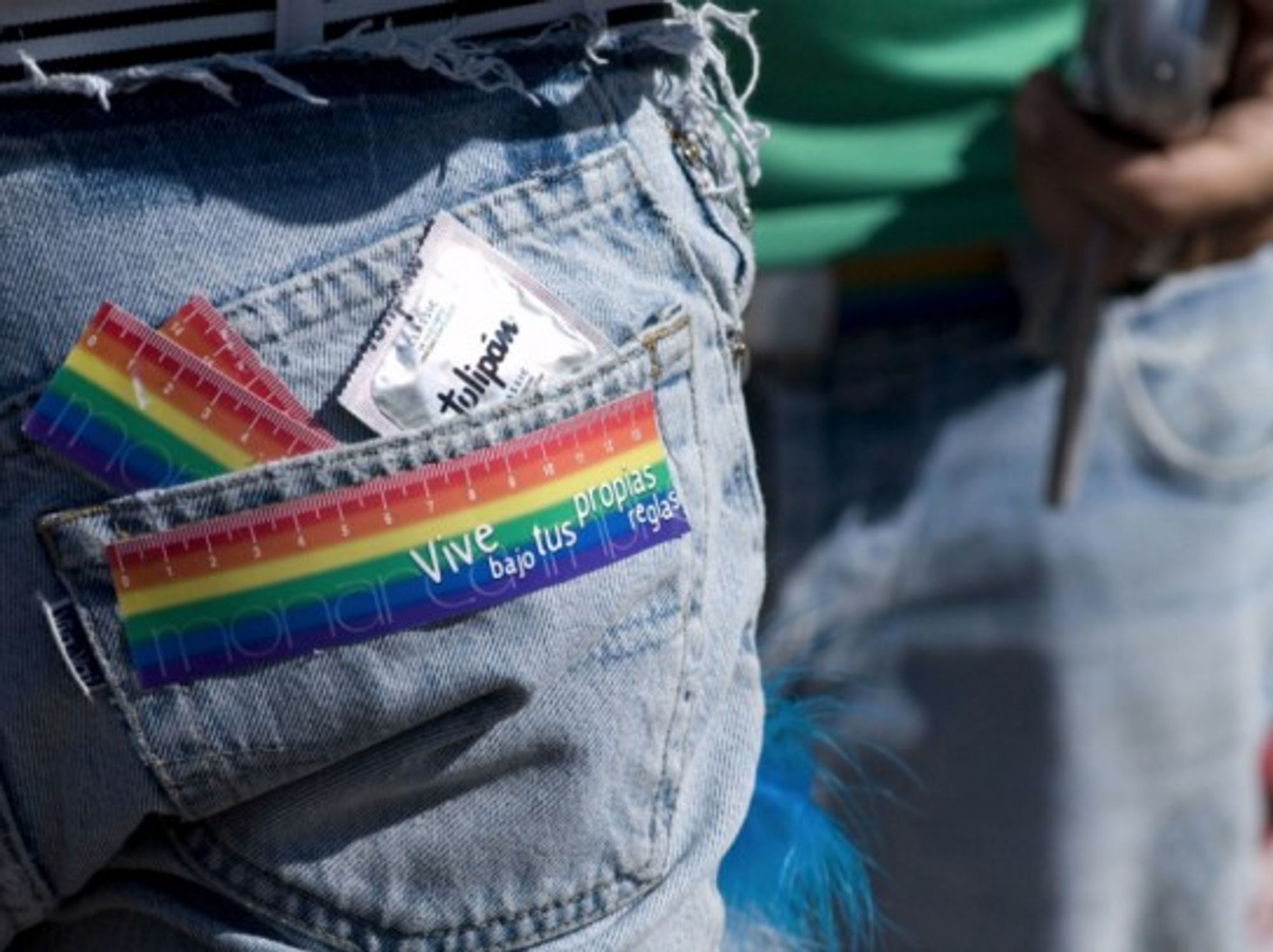 A sticker on the back of a marcher's jeans reads 'live under your own rules' and he carries a condom in his back pocket during the 17th annual gay, lesbian, transsexual and bisexual pride festival and march in the Plaza de Mayo in Buenos Aires, Argentina