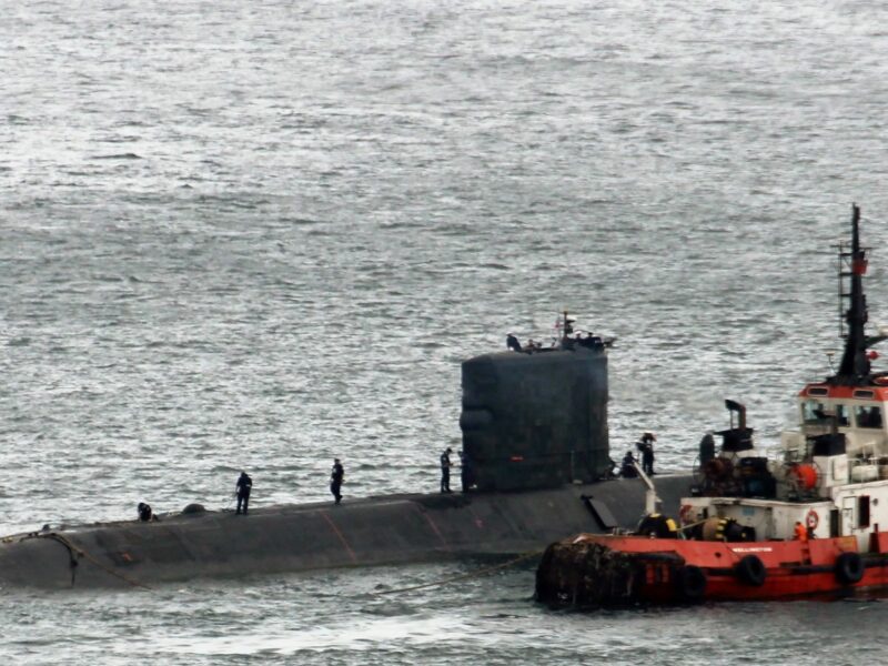 A submarine departing a naval base in Gibraltar.