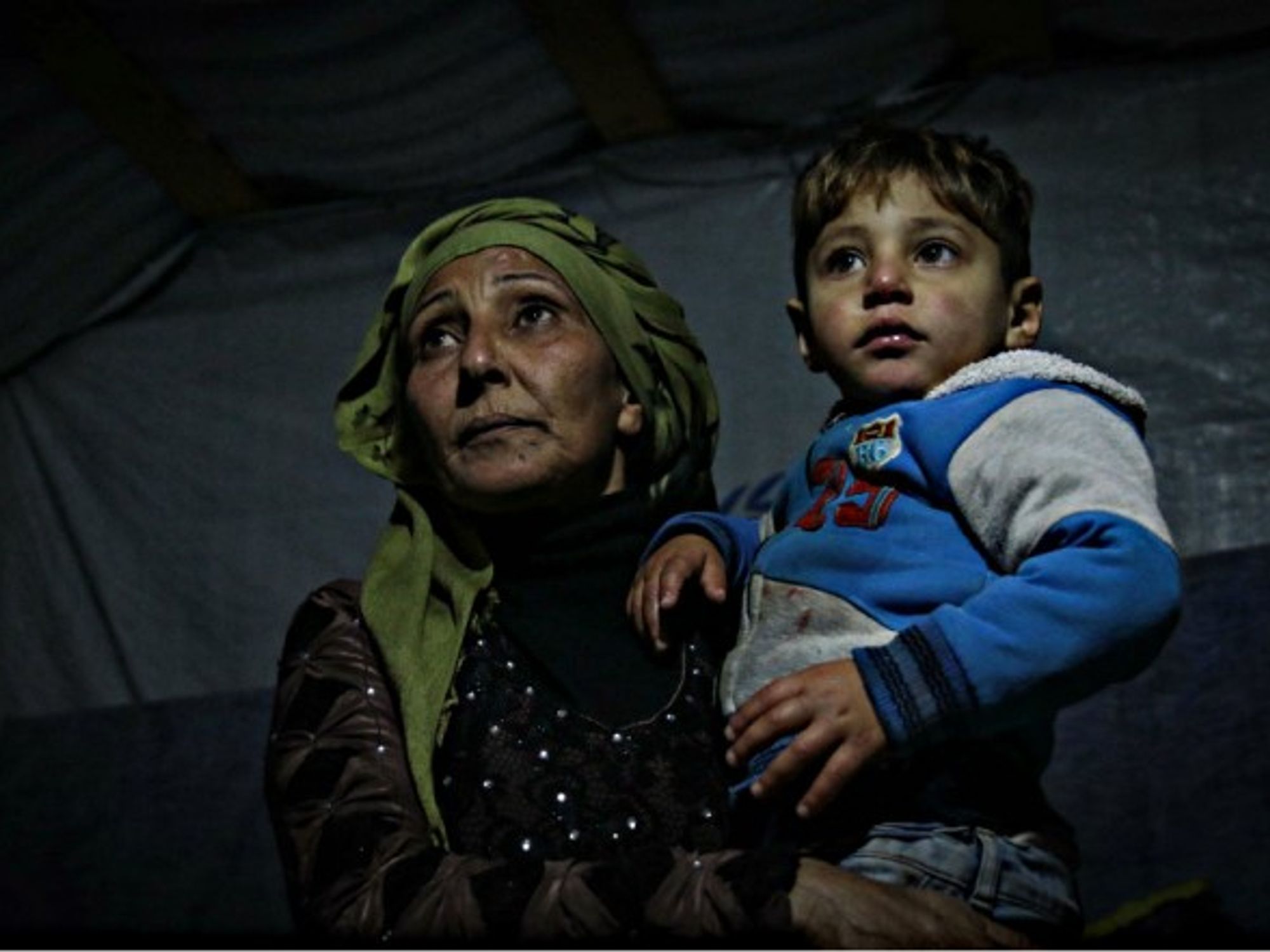 A Syrian mother and her son in a Lebanese refugee camp.