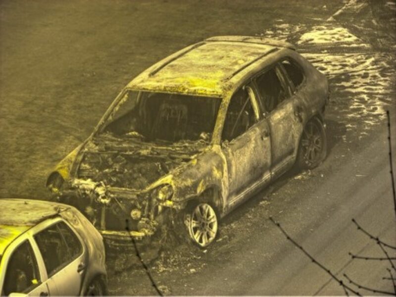A torched luxury car in Berlin, Germany (2009)