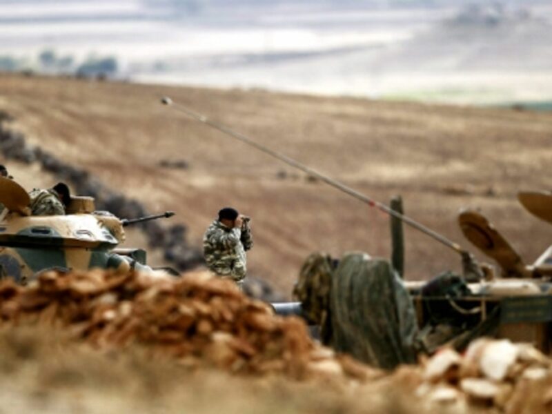 A Turkish army investigator looks over the Syrian border last October.