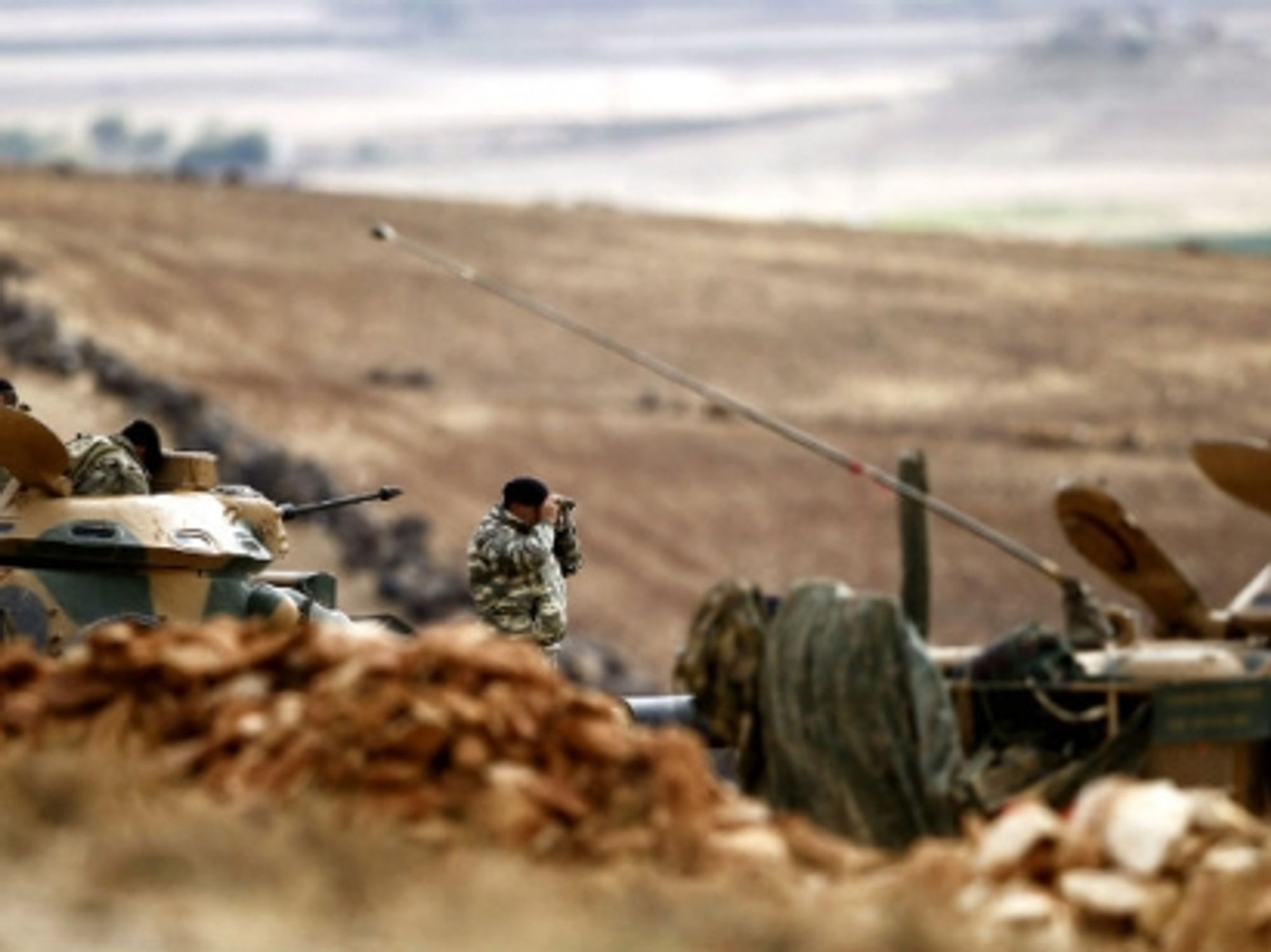 A Turkish army investigator looks over the Syrian border last October.