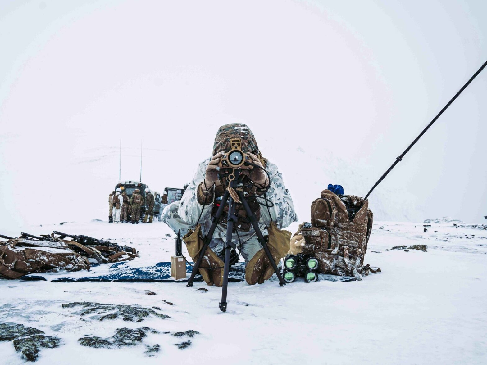 A U.S. Marine scans for targets for a Fire Support Coordination exercise prior to Exercise Cold Response 22 in Setermoen, Norway