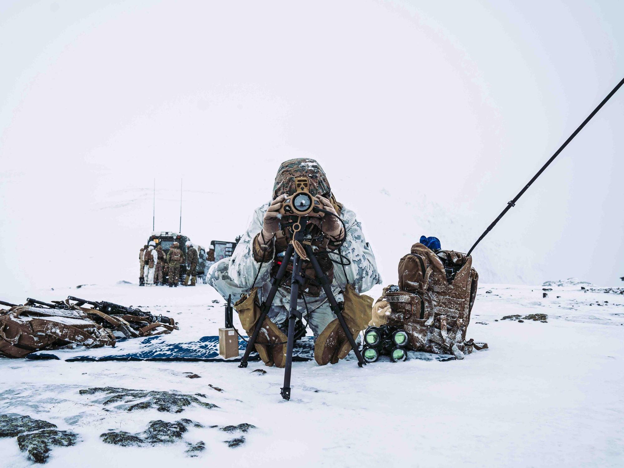 A U.S. Marine scans for targets for a Fire Support Coordination exercise prior to Exercise Cold Response 22 in Setermoen, Norway