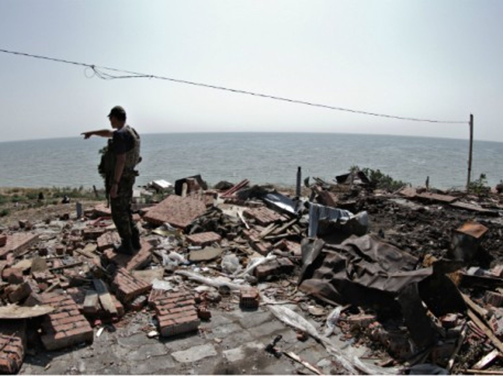 A Ukrainian soldier checks a site destroyed by Russian forces on Aug. 7.