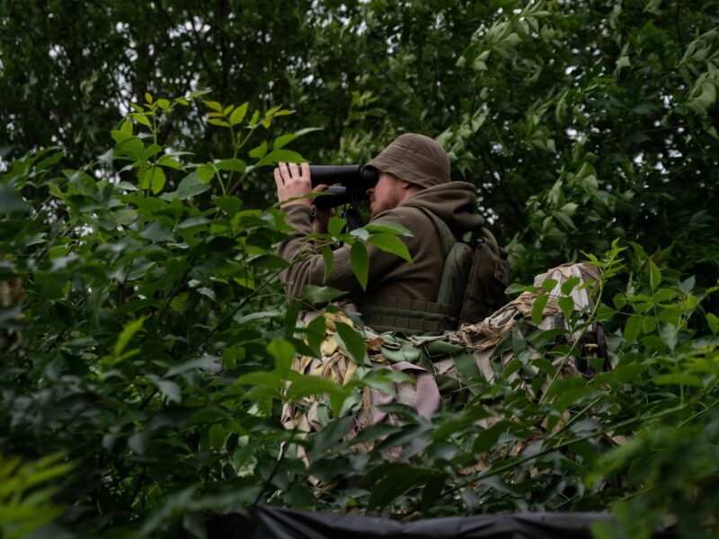 A Ukrainian soldier observes his enemies in the Kharkiv region.